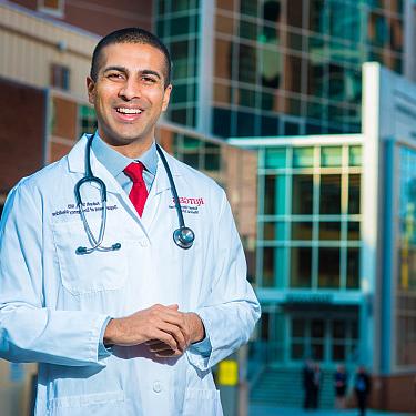 Dr. Aakash Shah poses for a photograph outside Robert Wood Johnson Hospital (Photo by William Tho...
